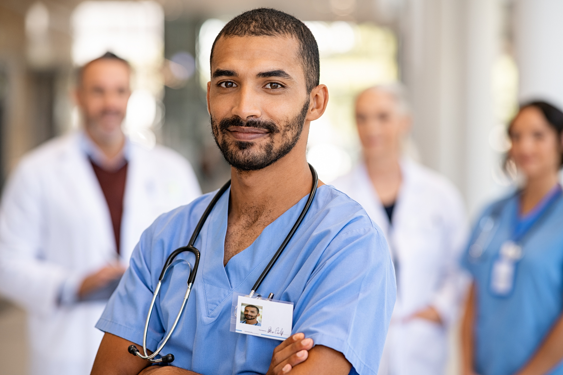 Young Confident Male Nurse Looking at Camera